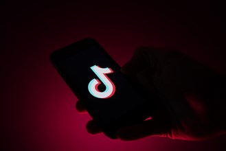 TikTok app on a smartphone in a hand