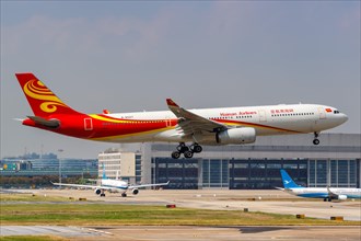 A Hainan Airlines Airbus A330-300 with registration number B-6527 at Shanghai Hongqiao Airport