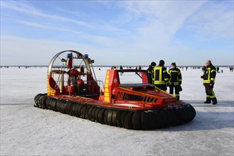 Hovercraft of the fire brigade on the frozen lake