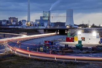 Motorway junction A 43 with A 42 with power station Herne and construction site in the evening