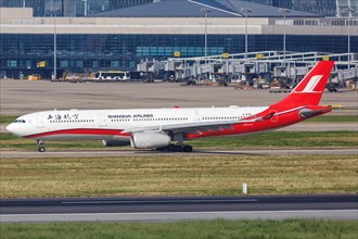 An Airbus A330-300 aircraft of Shanghai Airlines with registration number B-6096 at Shanghai airport
