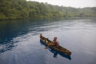 Indigenous people in monoboat
