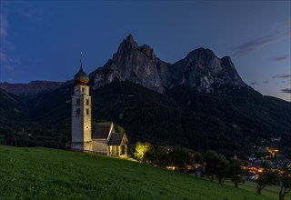 Church San Valentino at the blue hour in front of the Schlern