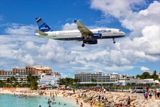 A JetBlue Airways Airbus A320 with the registration N597JB lands at the airport of St. Maarten