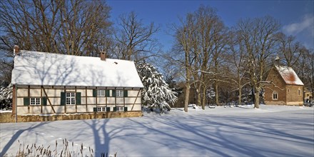 Half-timbered house at Vischering Castle in winter