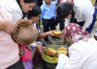 Typical food is distributed at a folk festival