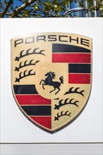 Porsche logo symbol sign headquarters in Stuttgart Zuffenhausen Germany portrait format