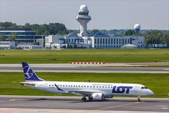 An Embraer 195 of LOT Polskie Linie Lotnicze with the registration SP-LNK at Warsaw Airport