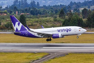 A Wingo Boeing 737-700 aircraft with registration number HP-1525CMP lands at Medellin Rionegro Airport