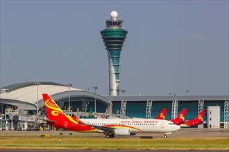 A Hainan Airlines Boeing 737-800 aircraft with registration number B-1130 at Guangzhou Airport