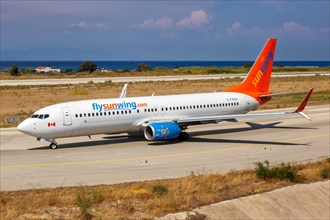 A Sunwing Boeing 737-800 with registration C-FWGH at Rhodes Airport