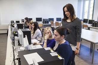 Vocational school students in class at the computer. Dual system at the Elly-Heuss-Knapp-Schule