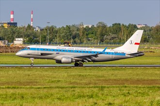 An Embraer 175 of LOT Polskie Linie Lotnicze with the registration SP-LIM in the retro special livery at Warsaw Airport