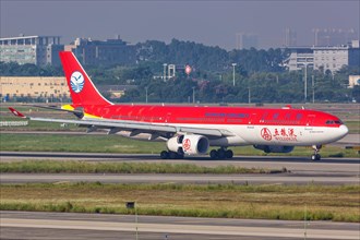 An Airbus A330-300 aircraft of Sichuan Airlines with registration number B-5923 and Wuliangye special livery at Guangzhou Airport