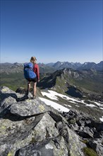 Hiker on the trail to the mountain Rundfjellet