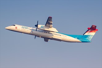 A Bombardier DHC-8-400 of Luxair with registration LX-LGN at Malpensa Airport in Milan