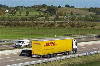 DHL truck driving on the A8 motorway near Jettingen