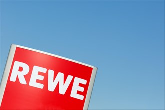 REWE logo symbol sign text free space copyspace supermarket food store shop in germany