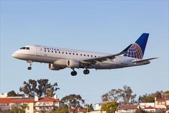 A United Express Skywest Embraer ERJ 175 aircraft with registration number N151SY lands at San Diego Airport