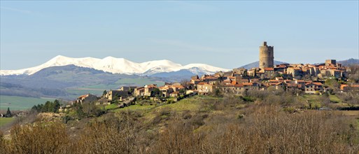 Village of Montpeyroux and view on Sancy massif in winter