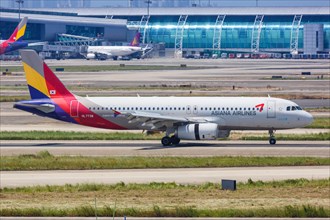 An Airbus A320 aircraft of Asiana Airlines with registration number HL7738 at Guangzhou airport