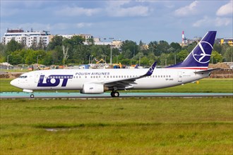 A Boeing 737-800 aircraft of LOT Polskie Linie Lotnicze with registration SP-LWD at Warsaw Airport