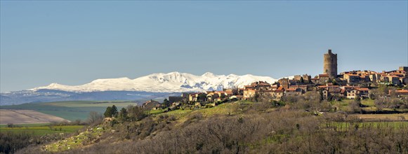 Village of Montpeyroux and view on Sancy massif in winter