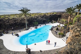 Turquoise pool above the Jameos del Agua lava tunnel formed in a museum of Cesar Manrique