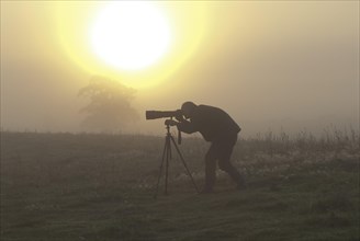 Nature photographer at sunrise