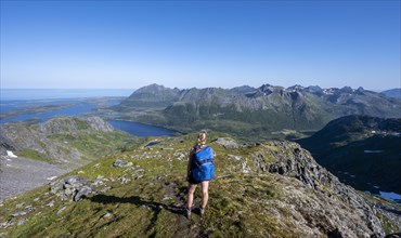 Hiker on the trail to the mountain Rundfjellet