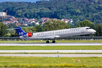 A Bombardier CRJ-900 of SAS Scandinavian Airlines with registration EI-FPV lands at Stuttgart Airport