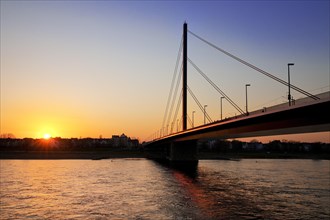 Rhine with Oberkassel Bridge at sunset