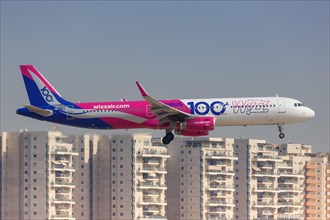 An Airbus A321 aircraft of Wizzair with the registration number HA-LTD and the special livery Airbus 100 lands at Tel Aviv Airport
