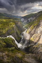 View into the river valley with waterfall Voringfossen