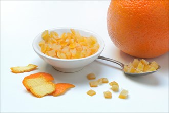 Candied orange peel cubes in small bowls
