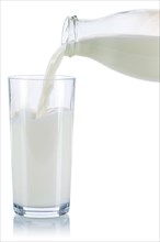 Pouring milk pouring glass bottle milk glass isolated against a white background