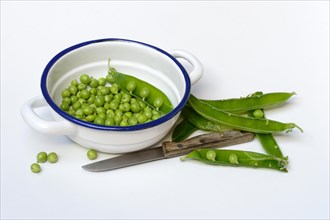 Green peas in pod and knife
