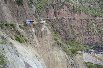 Coach and truck above the gorge of the Rio Mantaro