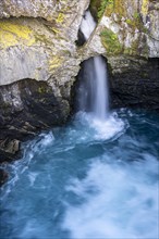 Waterfall Gudbrandsjuvet flows through rocks