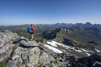 Hiker on the trail to the mountain Rundfjellet