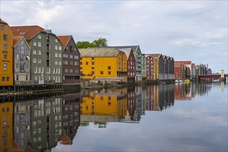 Colourful historic warehouses by the river Nidelva