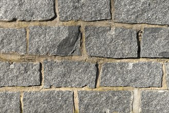 Wall of granite stones