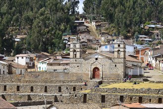 Inca sun temple with colonial cathedral on top in the middle of the village