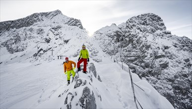 Two ski tourers at the summit of the Osterfelderkopf in the snow