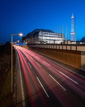 Evening traffic on the motorway at the ICC with radio tower in the background in Berlin