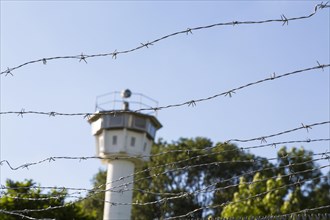 Barbed wire and historical observation tower