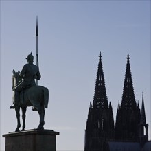 Monument of the 8th Prussian Cuirassier Regiment with the silhouette of the cathedral
