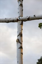 Cross made of birch trunks