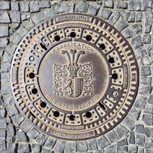 Manhole cover with coat of arms of the city of Leipzig