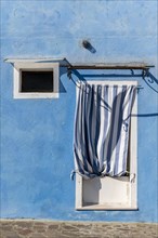 Door and window of a blue house